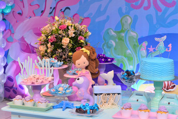 Obraz na płótnie Canvas table with sweet cake and candles, table with cake and sweets, condensed milk candy balls, candy balls