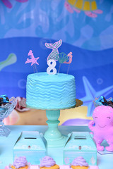 blue birthday cake with candles, themed party, birthday table setting, party table setting, table...