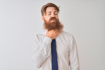 Young redhead irish businessman standing over isolated white background Touching painful neck, sore throat for flu, clod and infection