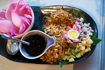 Snack thai style ( A royal leaf wrap appetizer - Each leaf-wrapped parcel is a kaleidoscope of...