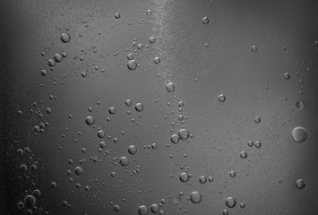 Air bubbles in the water background.Abstract oxygen bubbles in the sea.Water bubbles isolate on black background.Black and white tone style.
