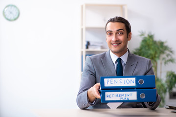 Young male accountant working in the office