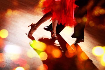 Man and a woman dancing Salsa on background