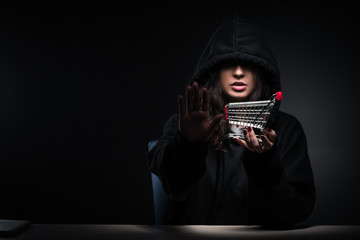 Female hacker hacking security firewall late in office