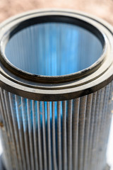 Shop vacuum cartridge air filter with wood chips captured