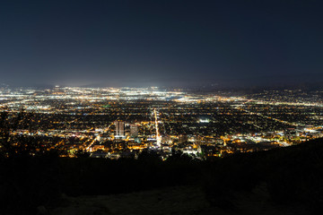 Night cityscape view of the Burbank media district and the San Fernando Valley area of Los Angeles, California.  Shot from hilltop near popular Griffith Park.  