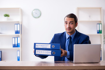 Young male accountant working in the office