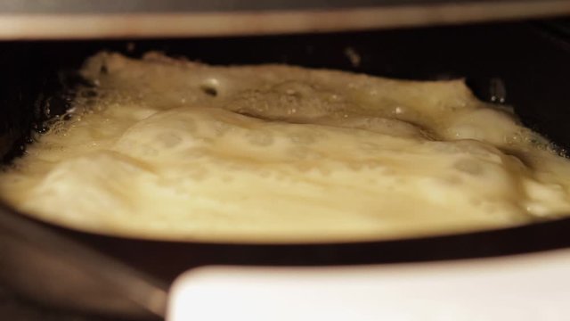 extreme close-up of raclette slice cheese melting and bubbling