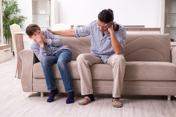 Fototapeta premium Father beating and punishing his sone