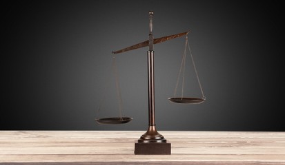 Law scales on table background. Symbol of justice