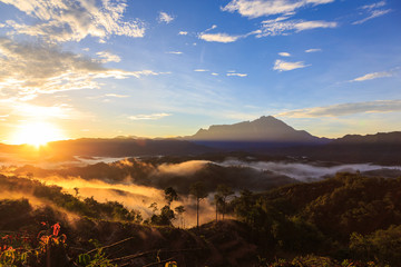 Amazing Beautiful Nature landscape view of Sunrise with  nature misty foggy and Mount Kinabalu,...