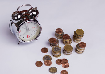 coins and clock, economy and time