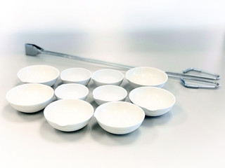 Evaporating Dish and Crucible tong prepare for analysis total solids in waste water sample, heat up...