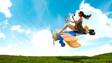 Woman in retro airplane . Mixed media