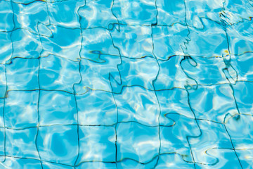 Water surface in blue swimming pool
