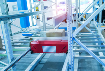 boxes in the cells of the automated warehouse. Metal construction warehouse shelving