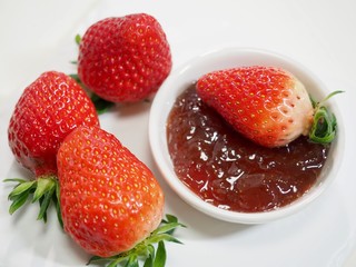 Fresh strawberries and strawberry jam