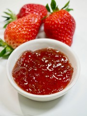 Fresh strawberries and strawberry jam
