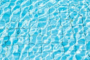 Water surface in blue swimming pool
