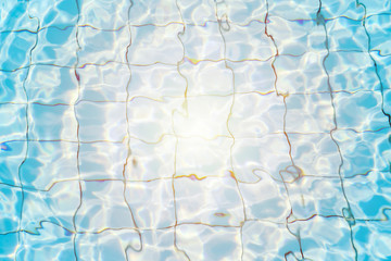 Water surface in blue swimming pool