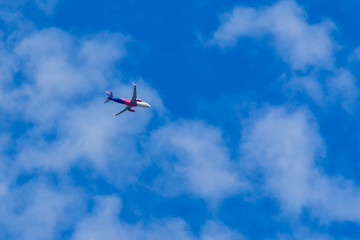 Airplane flying in the blue sky