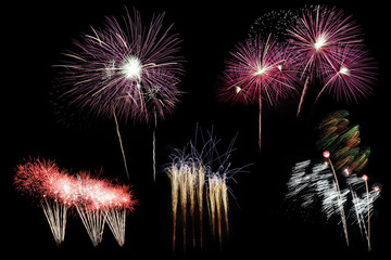 Festive fireworks colorful display isolated in bursting shapes on black background. Beautiful light for celebration. Show explosion happy new year wallpaper.