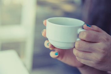 Woman drinking coffee in hand