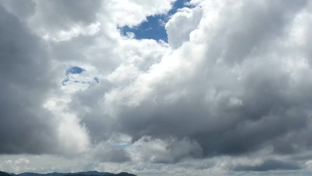 Hyperlapse aerial video of clouds forming above mountains 