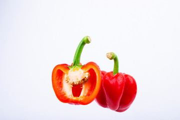 Sweet peppers on a white background,Half cut chilli, Organic vegetables