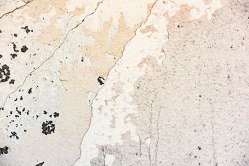 Texture of a concrete wall with cracks and scratches which can be used as a background