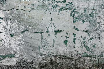 Texture of a concrete wall with cracks and scratches which can be used as a background