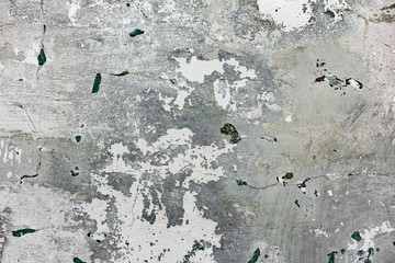 Texture of a concrete wall with cracks and scratches which can be used as a background