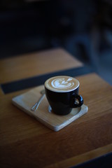 cup of coffee latte art in cafe