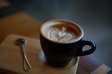 cup of coffee latte art in cafe