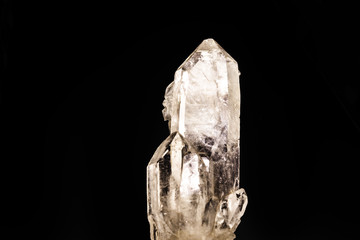 Fototapeta premium Quartz is the second most abundant mineral on earth and has a trigonal crystal structure composed of silica tetrahedra. Mining concept, semi precious rough stone.