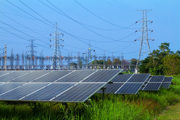 power solar panel and High voltage post in Power plant on blue sky background,alternative clean...