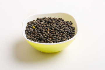 black gram seed or udad beans in bowl on white background 