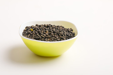 black gram seed or udad beans in bowl on white background 