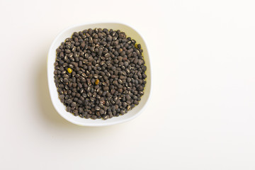 black gram seed or udad beans in bowl on white background 