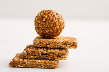 Indian sweet dish,Sesame seeds ball or called in hindi, til ke laddu on white background 