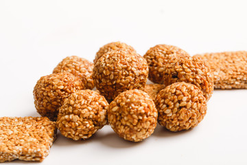 Indian sweet dish,Sesame seeds ball or called in hindi, til ke laddu on white background 