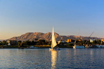 Traditional egyptian vessel felucca on a Nile river in Luxor, Egypt