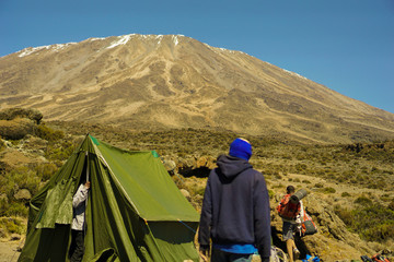 Camping spot on the mountain on the way up Kilimanjaro Mountain in Tanzania blue sky