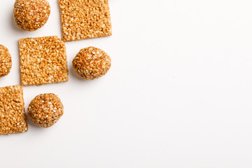Indian sweet dish,Sesame seeds ball or called in hindi, til ke laddu on white background 