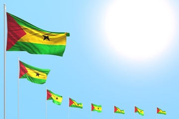 pretty many Sao Tome and Principe flags placed diagonal on blue sky with place for content - any occasion flag 3d illustration..