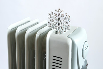 Electric heating battery on a white background. Conservation concept.