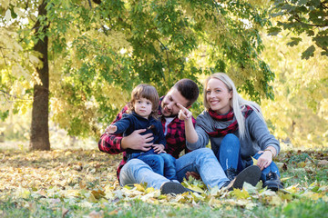 Fototapeta premium Young happy family spending time together outdoors