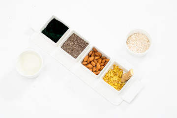 ingredients and seeds on white background