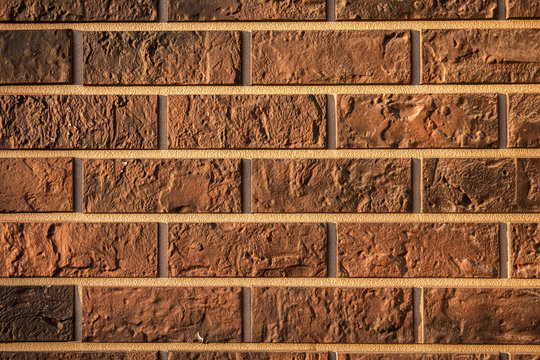 brown decorative urban brick house wall