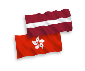 Flags of Latvia and Hong Kong on a white background